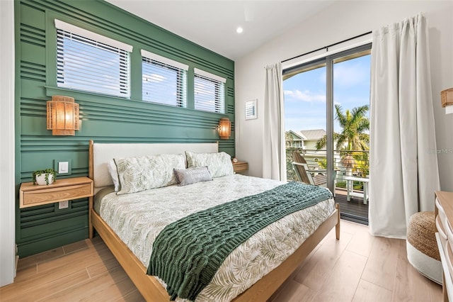 bedroom with access to outside, light hardwood / wood-style flooring, and ceiling fan