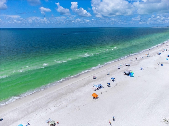 birds eye view of property featuring a water view and a view of the beach