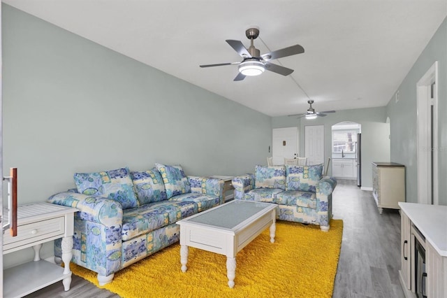 living room with ceiling fan and wood-type flooring