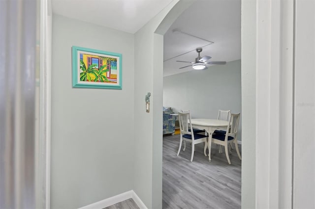 hallway with light hardwood / wood-style floors