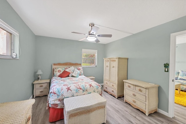 bedroom with ceiling fan and light hardwood / wood-style floors