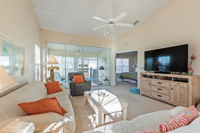 living room featuring light carpet, high vaulted ceiling, and ceiling fan