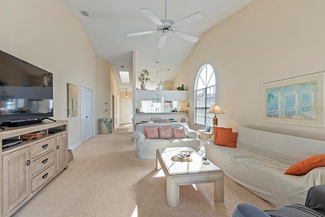 living room featuring ceiling fan, light carpet, and high vaulted ceiling