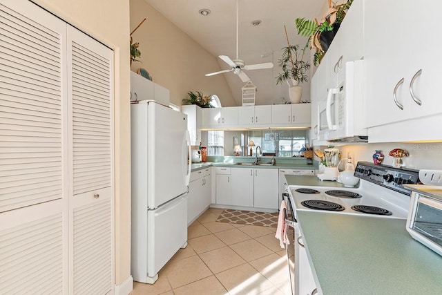 kitchen featuring white appliances, ceiling fan, high vaulted ceiling, white cabinets, and light tile patterned flooring