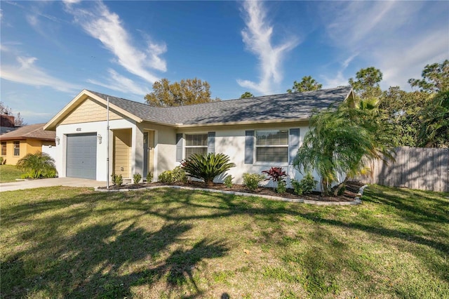 single story home with a garage and a front lawn