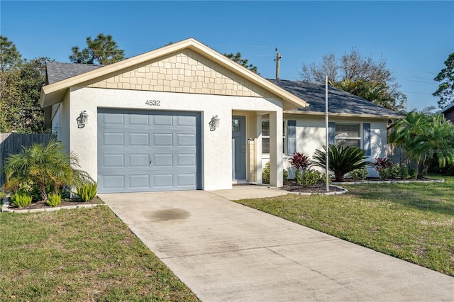 ranch-style house featuring a garage and a front lawn