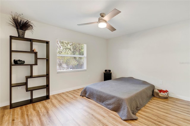 bedroom featuring light wood-type flooring and ceiling fan