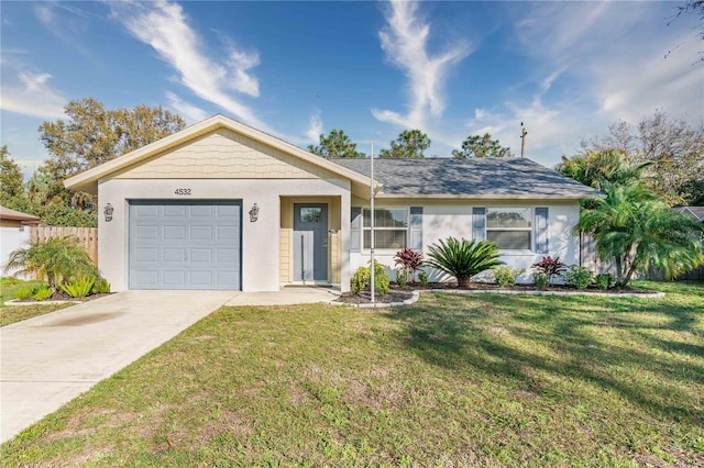 ranch-style home featuring a garage and a front lawn