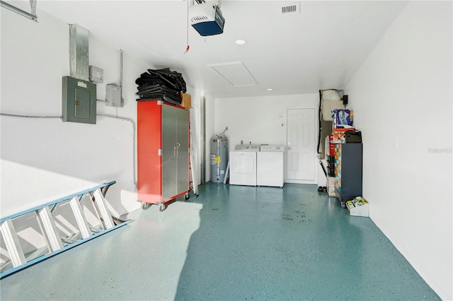 garage featuring independent washer and dryer, electric water heater, electric panel, and a garage door opener