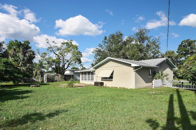 view of home's exterior featuring a lawn