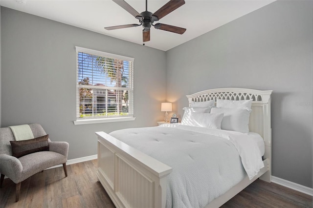 bedroom featuring ceiling fan and dark wood-type flooring