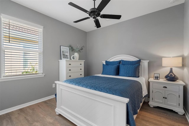 bedroom featuring wood-type flooring and ceiling fan