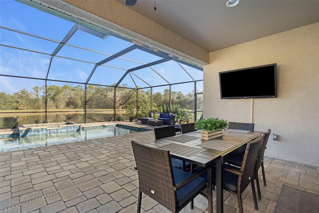 view of patio featuring a lanai, outdoor lounge area, and a pool with hot tub