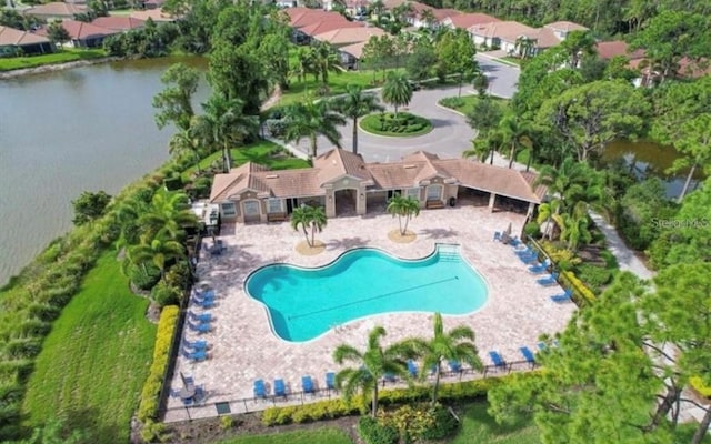 view of pool featuring a water view