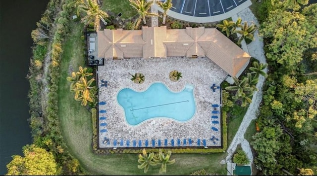 birds eye view of property with a water view