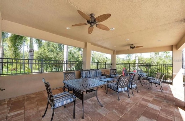 view of patio / terrace featuring ceiling fan and an outdoor living space