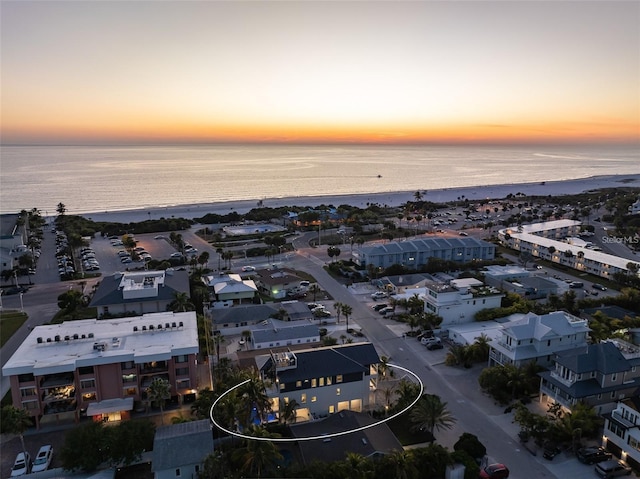 aerial view at dusk with a water view