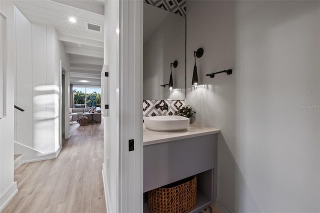 bathroom with vanity and hardwood / wood-style flooring