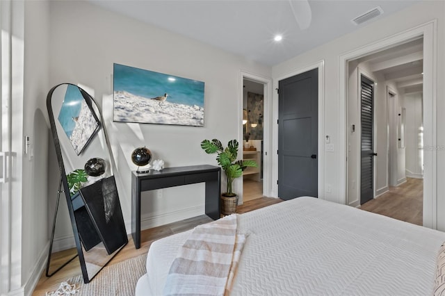 bedroom with hardwood / wood-style floors