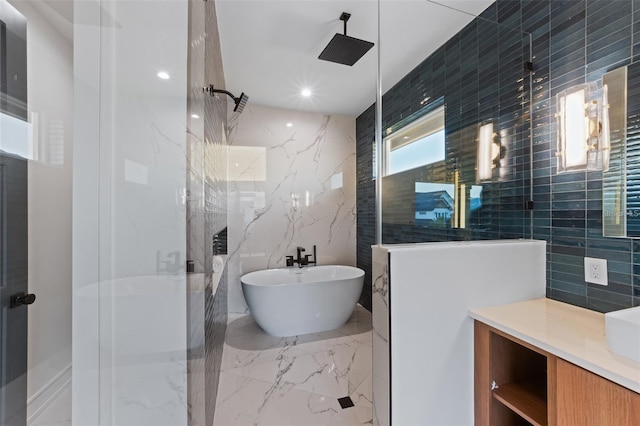 bathroom with tile walls and independent shower and bath