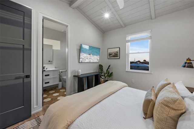 bedroom with connected bathroom, light hardwood / wood-style floors, wood ceiling, and vaulted ceiling with beams