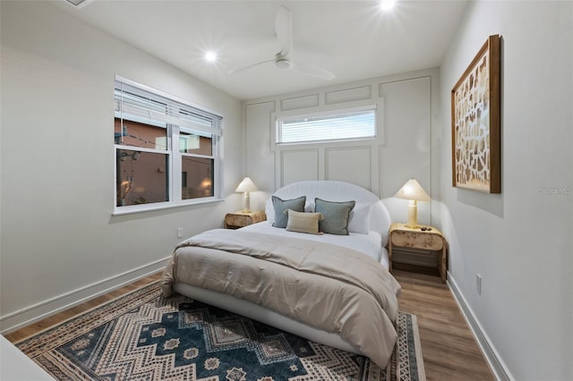 bedroom featuring ceiling fan and hardwood / wood-style flooring