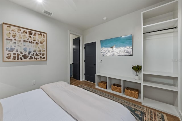 bedroom with hardwood / wood-style flooring