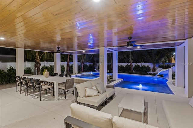 view of pool featuring an in ground hot tub, an outdoor living space, ceiling fan, and a patio area