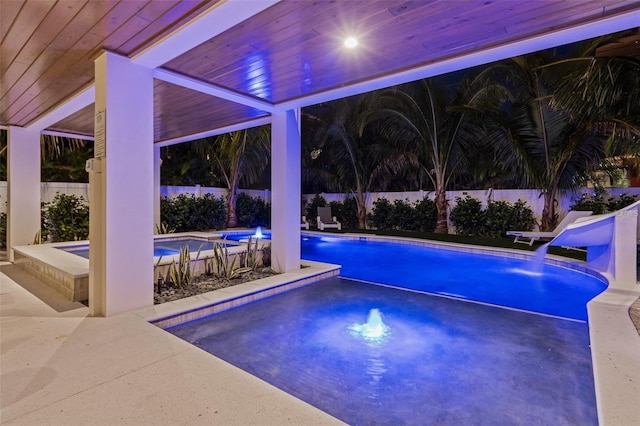 view of pool featuring a jacuzzi and pool water feature