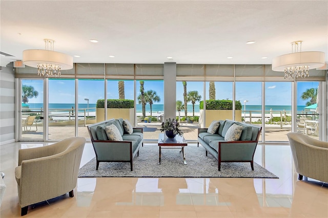 community lobby with a water view and a beach view