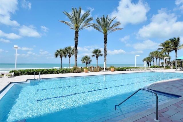 view of pool featuring a water view