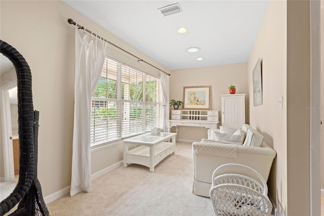 sitting room with light colored carpet