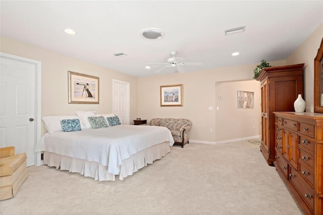 bedroom with light colored carpet and ceiling fan