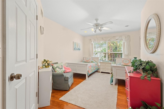 bedroom featuring ceiling fan and wood-type flooring