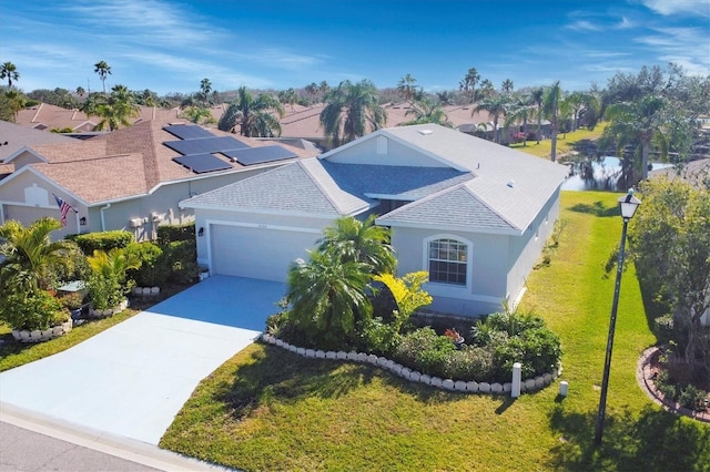 birds eye view of property with a water view and a residential view