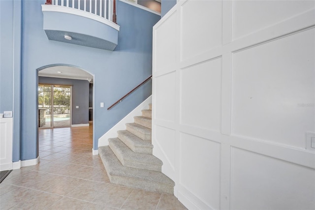 stairs featuring tile patterned floors