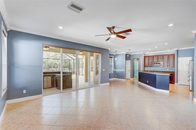 unfurnished living room with ceiling fan, light tile patterned floors, and ornamental molding