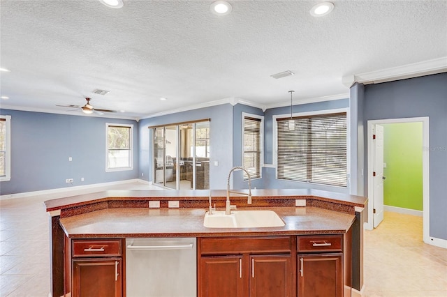 kitchen featuring ceiling fan, sink, hanging light fixtures, crown molding, and a textured ceiling