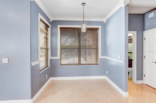 unfurnished dining area with light tile patterned floors and ornamental molding