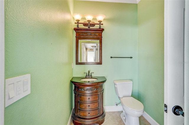 bathroom featuring tile patterned floors, vanity, and toilet