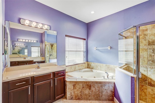 bathroom featuring vanity and plus walk in shower