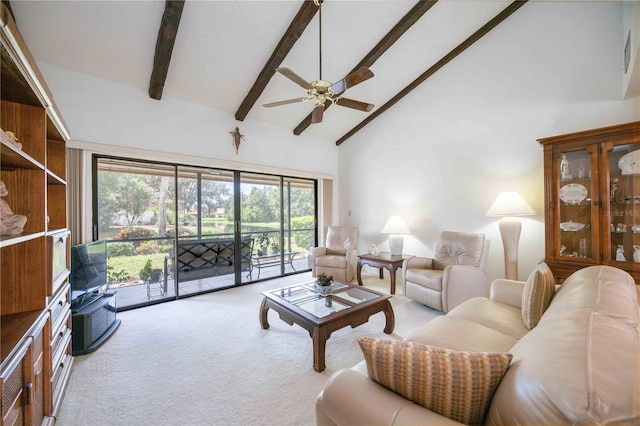 carpeted living room with beamed ceiling, ceiling fan, and high vaulted ceiling