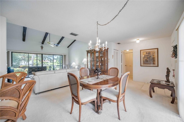 carpeted dining area with lofted ceiling and ceiling fan with notable chandelier