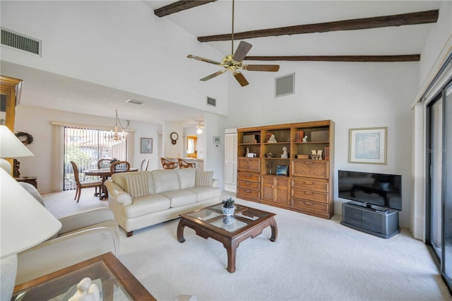 living room with high vaulted ceiling, beam ceiling, ceiling fan with notable chandelier, and light colored carpet