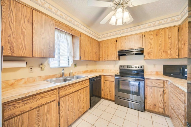 kitchen featuring sink, light tile patterned floors, ceiling fan, black appliances, and a textured ceiling