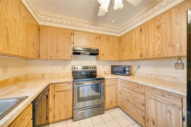 kitchen with sink, light tile patterned floors, ceiling fan, black appliances, and a textured ceiling