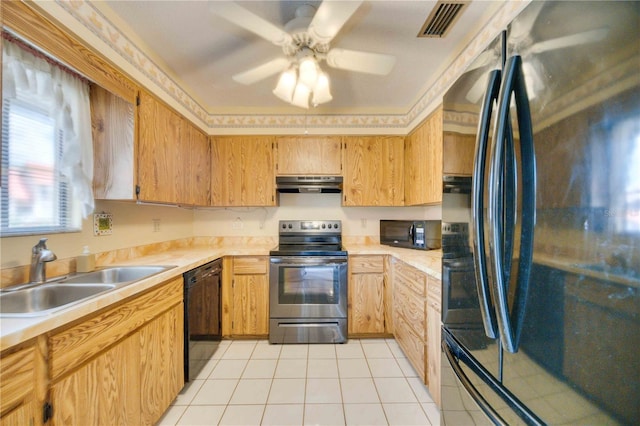 kitchen with sink, light tile patterned floors, ceiling fan, and black appliances