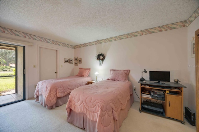 bedroom with access to exterior, light carpet, and a textured ceiling