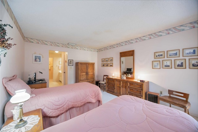 bedroom featuring ensuite bath