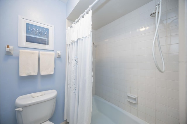 bathroom featuring shower / bath combination with curtain and toilet